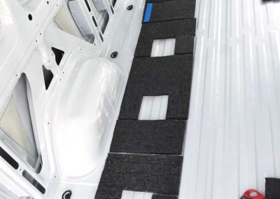 AutoPly insulation kit floor installation in Mercedes-Benz Sprinter 170 cargo van showing precision-cut sound deadening panels