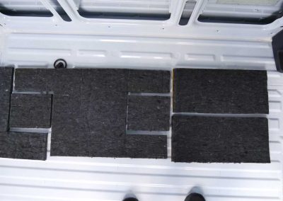 AutoPly floor insulation panels laid out inside Mercedes-Benz Sprinter 170 van during installation process